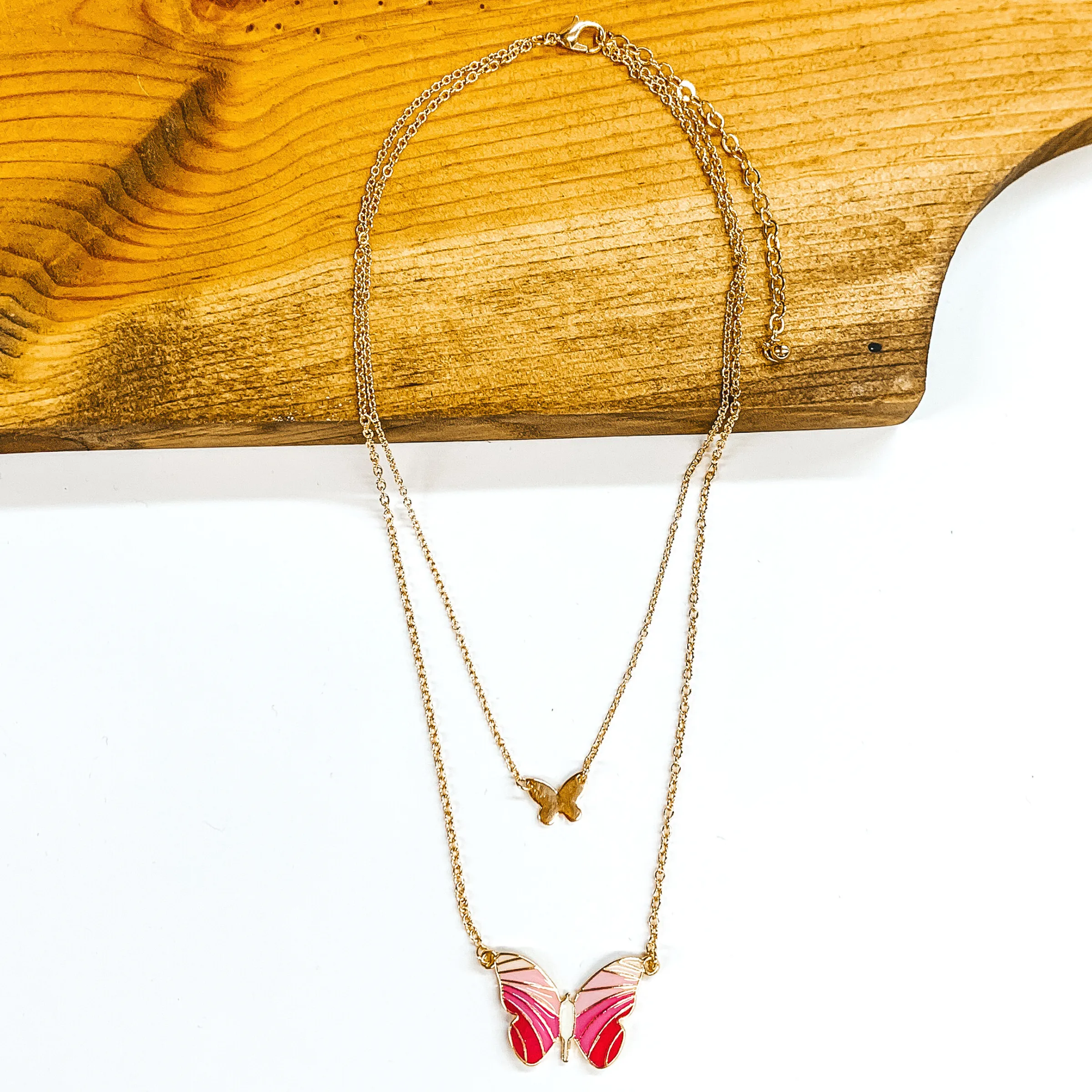 Double Gold Chain Necklace with a Butterfly Pendant in Pink